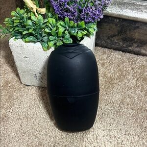 Sleek Black Oval Bottle